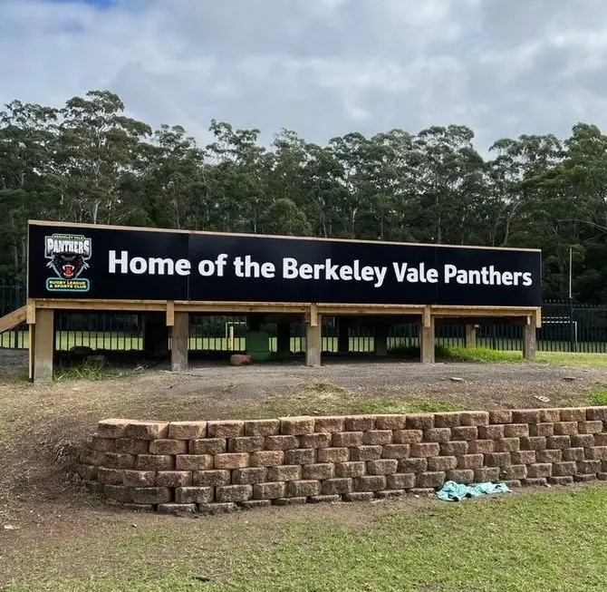 The "Home of the Berkeley Vale Panthers" sign above the grandstand at Berkeley Vale Oval